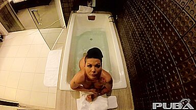 Jezebelle Bond films herself taking a bath